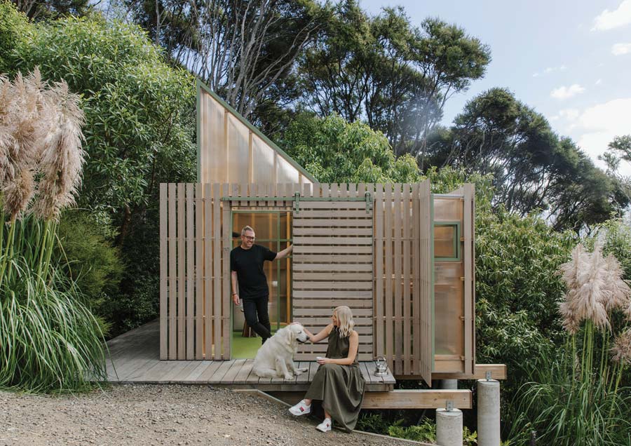 Mitchell Coll and Amy Douglas, with dog Foster, enjoy the comforts of their award-winning Nightlight, on Banks Peninsula. Image: Nancy Zhou Fabric Nightlight01